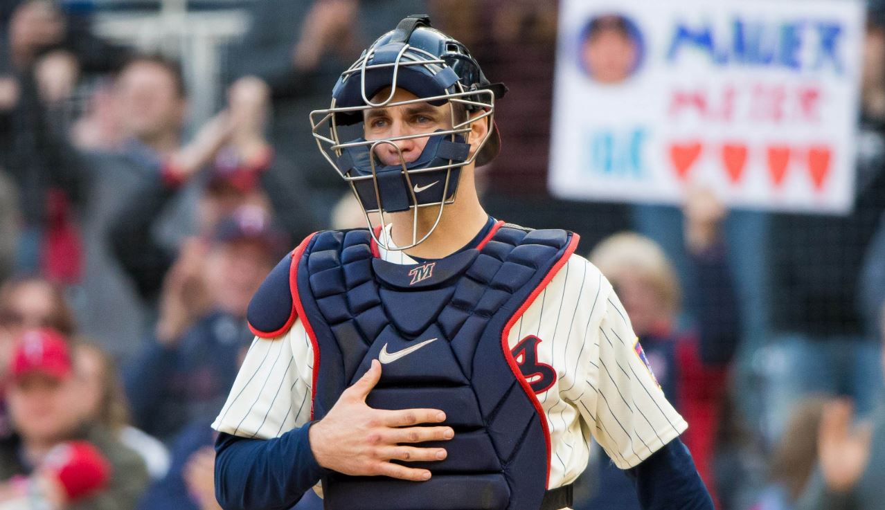 Joe Mauer behind the plate for the Minnesota Twins — before the August 2013 foul tip that ended his catching career.